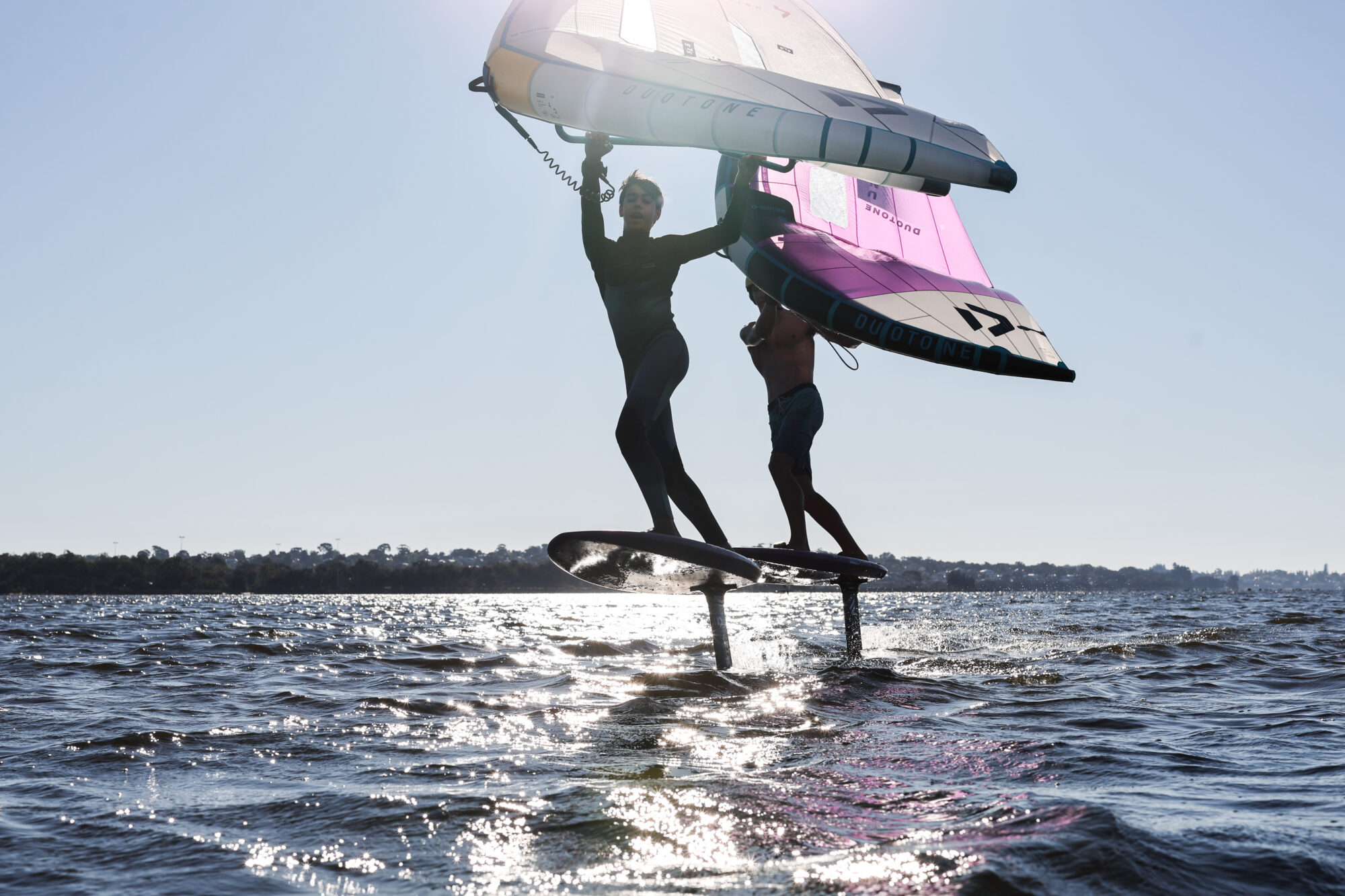 Junior Instructors Ben Gerhardt and Noah Karantonys wingfoiling on Swan River, Perth